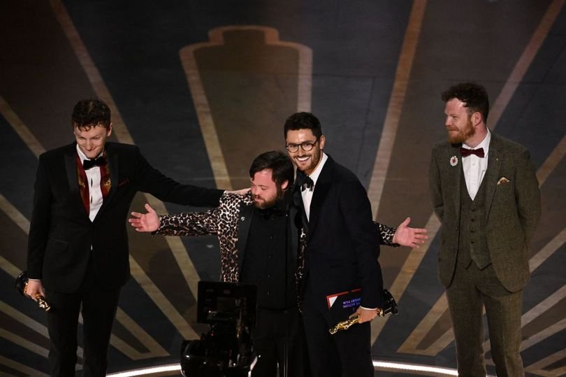 Filmmaker Ross White, actor James Martin, filmmaker Tom Berkeley, and screenwriter Seamus O'Hara accept the Oscar for Best Live Action Short Film for An Irish Goodbye onstage during the 95th Annual Academy Awards at the Dolby Theatre in Hollywood, California on 12 March 2023 (Image: Patrick T. Fallon / AFP via Getty Images)