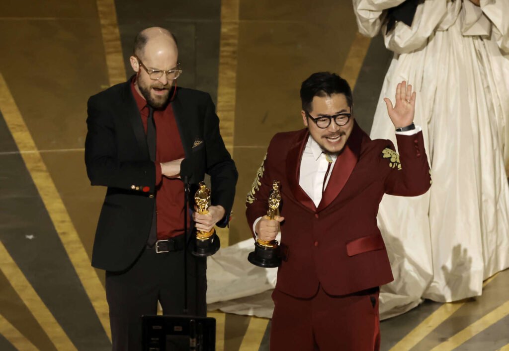 From left: Daniel Kwan and Daniel Scheinert win the Oscar for Best Original Screenplay for "Everything Everywhere All at Once", Daniel Kwan Thanks Daniel Scheinert, Who Pays Tribute To His Public School Teachers As Duo Nabs Original Screenplay Oscar during the Oscars show at the 95th Academy Awards in Hollywood, Los Angeles, California, US, March 12, 2023. 