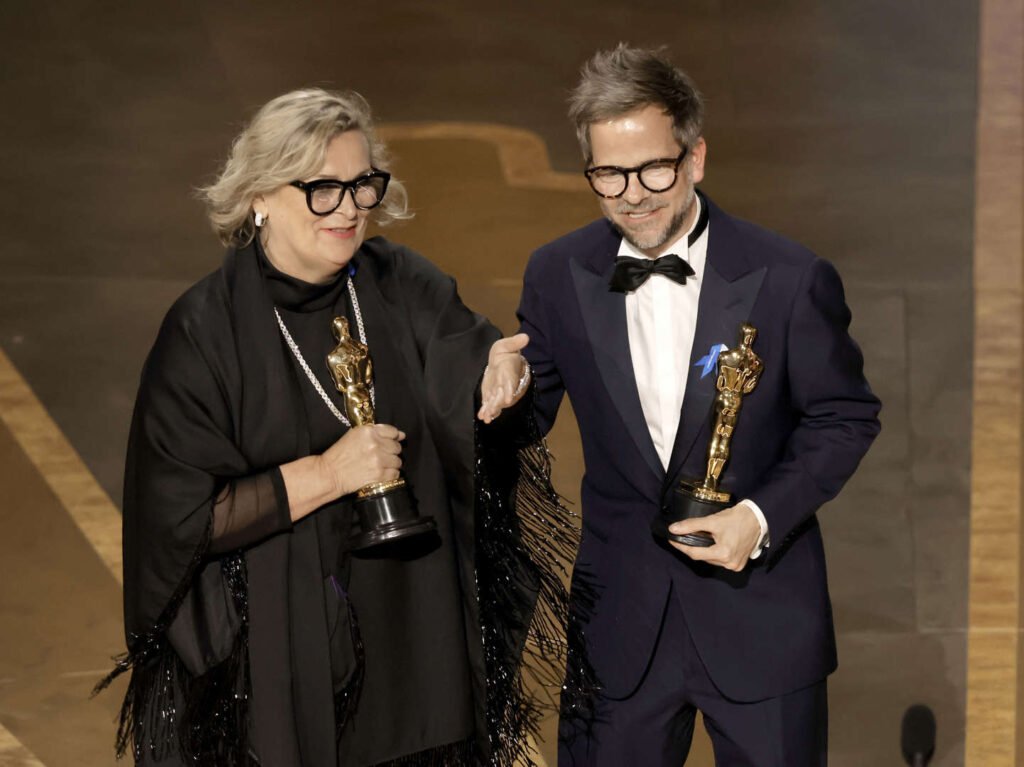 Ernestine Hipper and Christian M. Goldbeck accept the award for Best Production Design for "All Quiet on the Western Front" at the Oscars on Sunday, March 12, 2023, at the Dolby Theatre in Los Angeles 