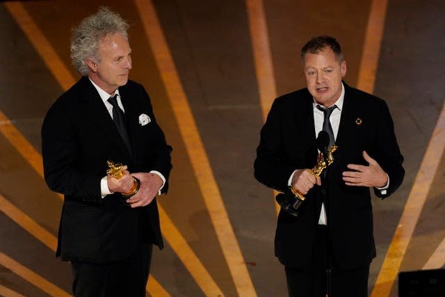 Charlie Mackesy left, and Matthew Freud accepts the award for Best Animated Short Film for "The Boy, the Mole, the Fox and the Horse" at the Oscars on Sunday, March 12, 2023, at the Dolby Theatre in Los Angeles (Chris Pizzello/AP)